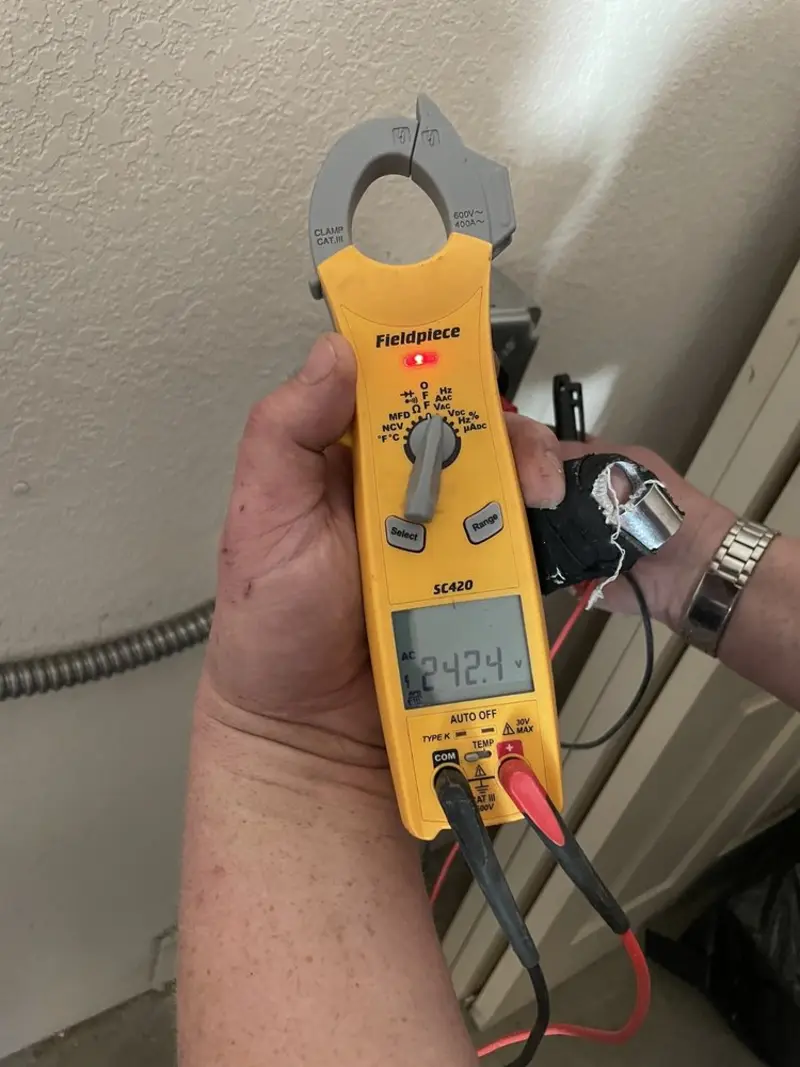 Voltage testing with clamp meter during Electrical Installation Services in Nashville